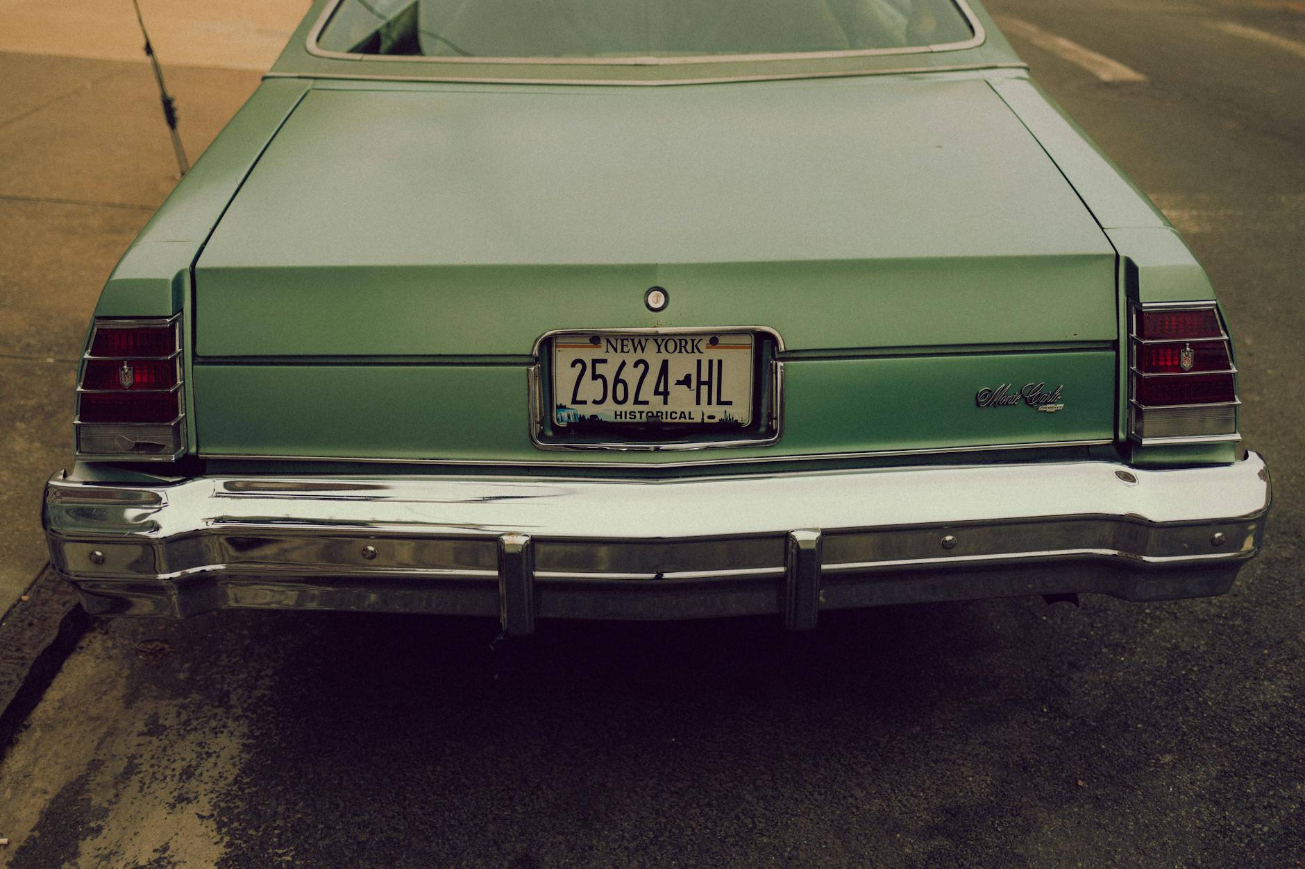 A backside photograph of Monte Carlo car of 1972 on a roadside. 